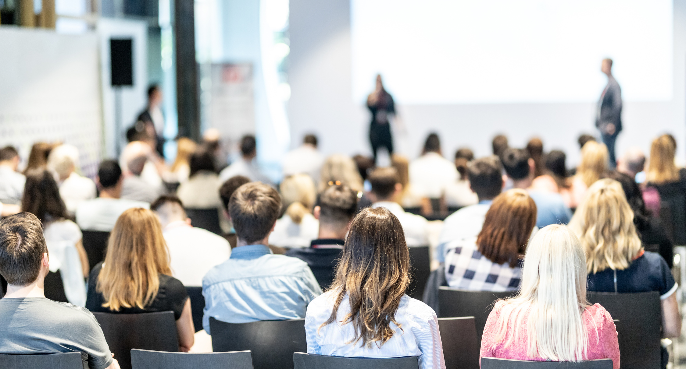 Business Speaker Giving a Talk at Business Conference Event